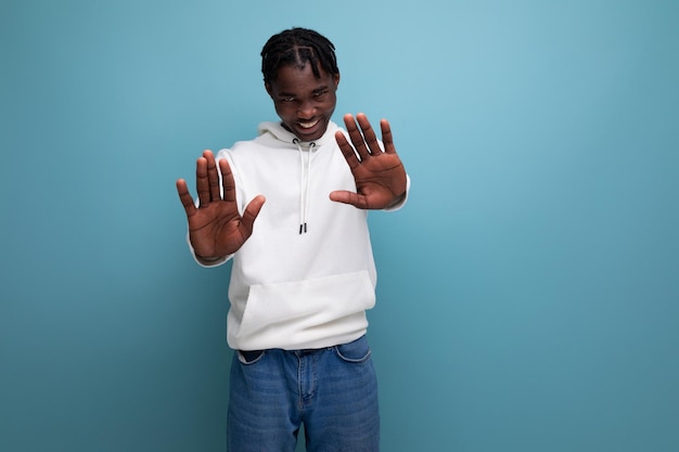 Handsome african young man with dreadlocks refuses