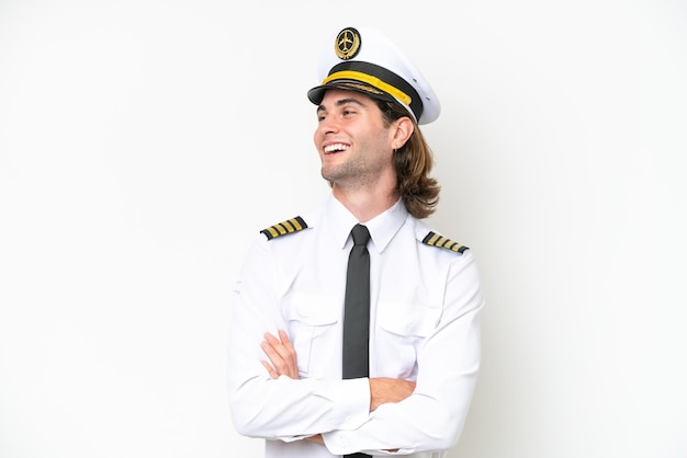 handsome airplane pilot isolated on white background happy and smiling