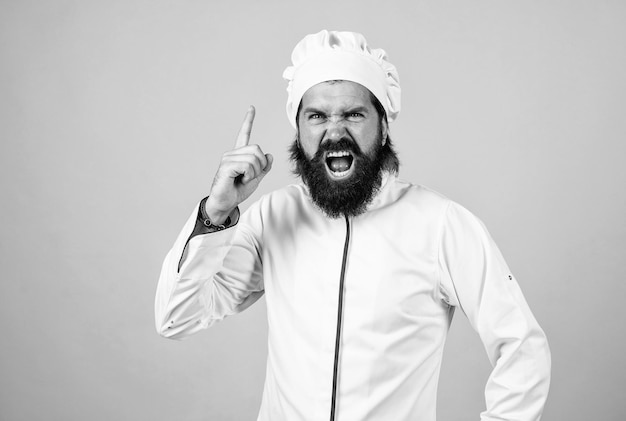 Handsome angry guy with beard and moustache raise finger idea