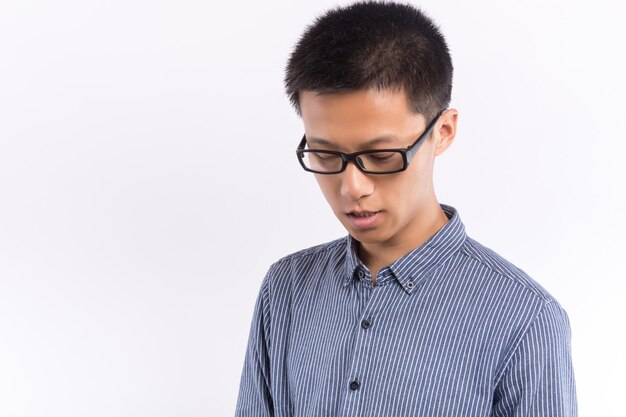 Handsome asian male in front of white background