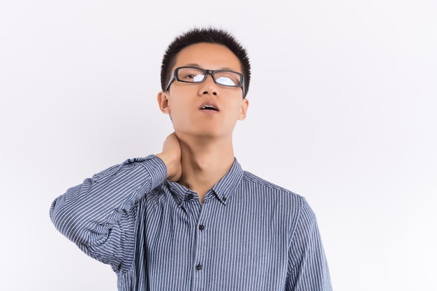 Handsome Asian male is thinking in front of white background