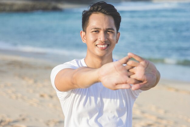 Handsome asian male warming up