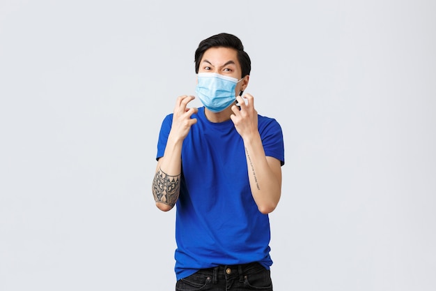 Handsome asian man wearing protective mask