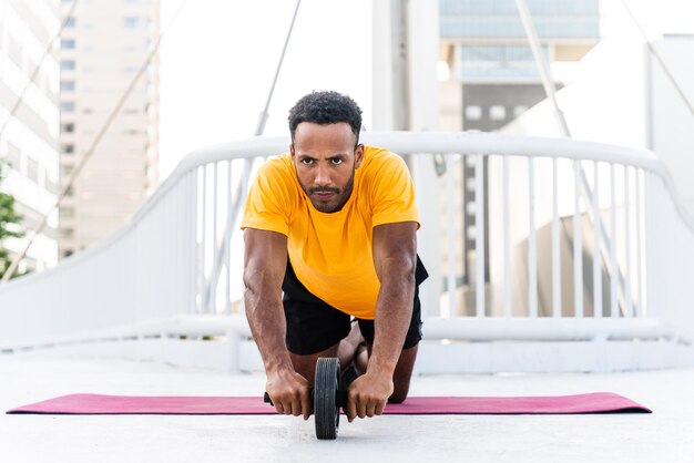 Handsome athletic african man training outdoors