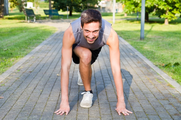 Handsome Athletic Man in Running Start Position