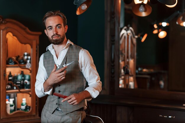 handsome barber is in the salon