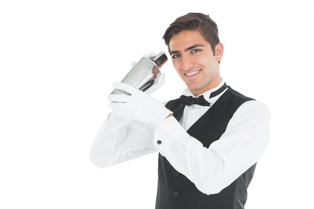 Photo handsome barkeeper shaking a drink