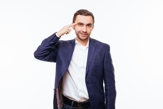 Handsome beard man, guy smiling and pointing to his head, isolated on white wall