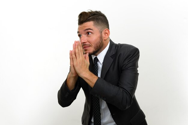 handsome bearded Hispanic businessman wearing suit on white