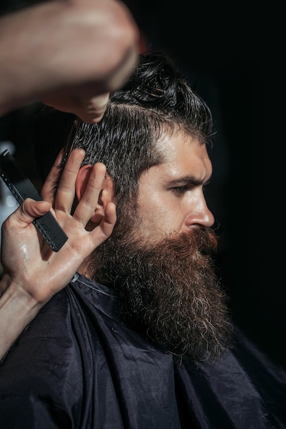 Handsome bearded man in barbershop