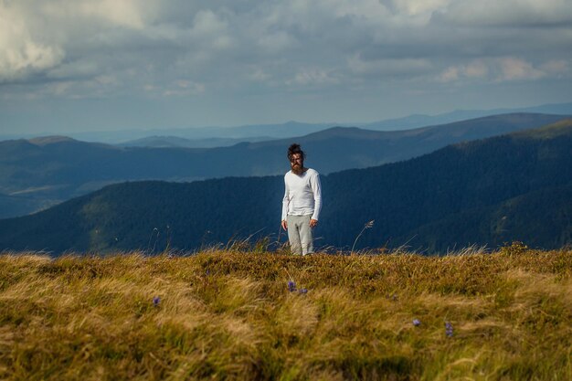 Handsome bearded man on mountain