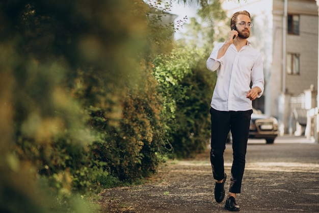 Handsome bearded man talking on the phone