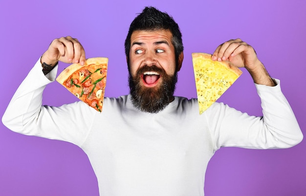 Handsome bearded man with slice of pizza hungry guy with delicious italian pizza