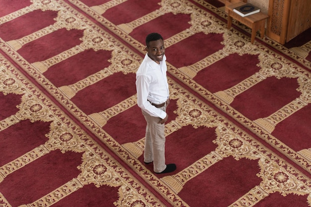 Handsome Black Man Smiling Is Praying In The Mosque