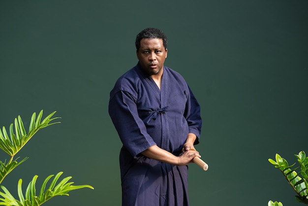 Handsome black martial artist man with martial arts costume of kendo