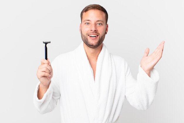 Handsome blonde man feeling happy, surprised realizing a solution or idea. shaving concept