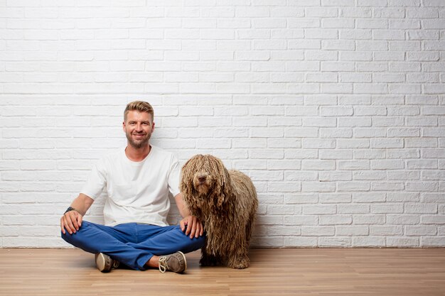 Handsome blonde man with a dog