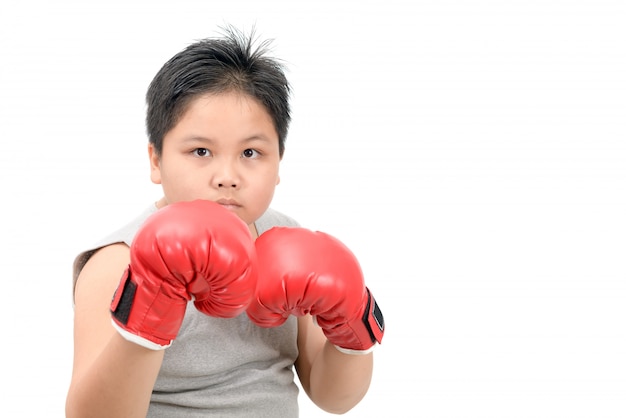 Handsome boy fighting with red boxing gloves 