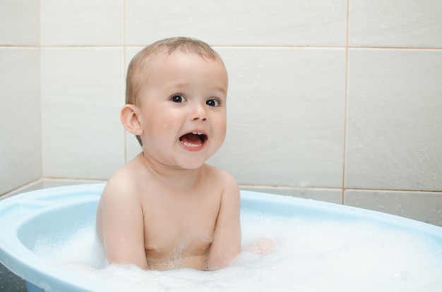 Handsome boy preschooler bathing in the bathroom clean and hygienic