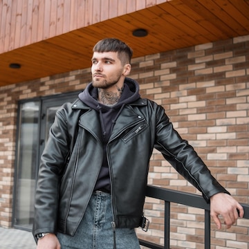 Premium Photo | Handsome brutal man hipster model in trendy casual outfit  with jacket and hoodie stands on the street