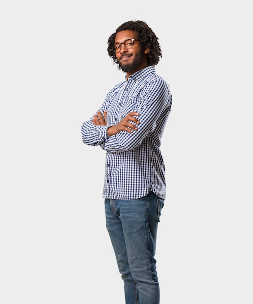 Handsome business african american man crossing his arms, smiling and happy