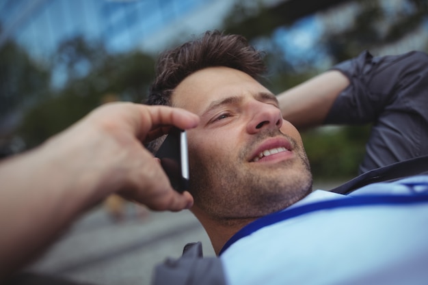 Handsome business executive talking on mobile phone