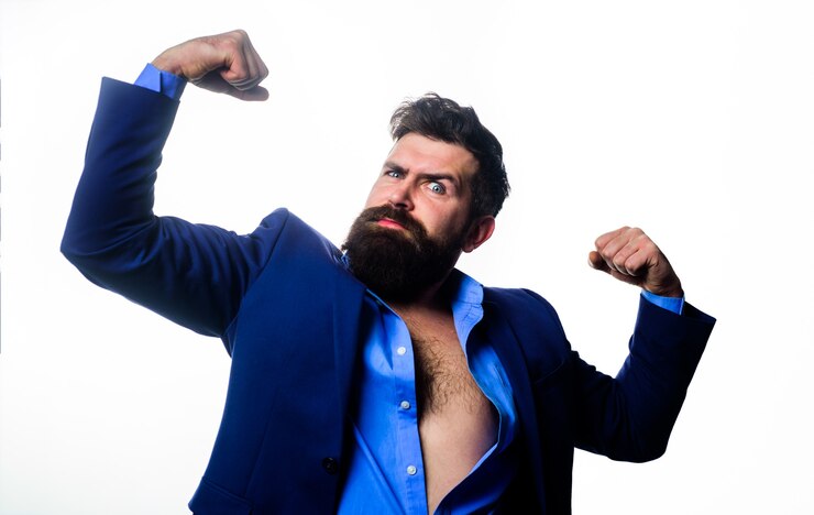 Photo handsome business man in suit showing arms muscles bearded man shows her muscles strength and power