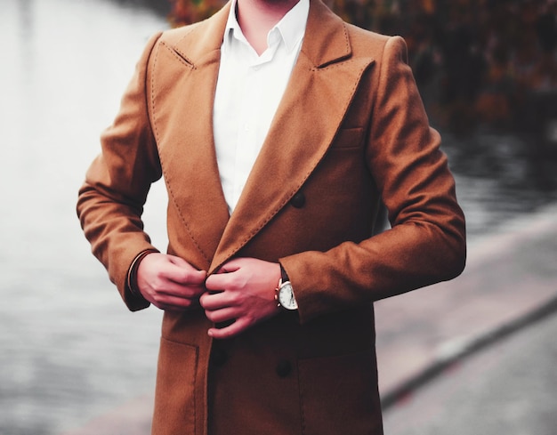 handsome businessman in autumn coat. business portrait. advertisement;