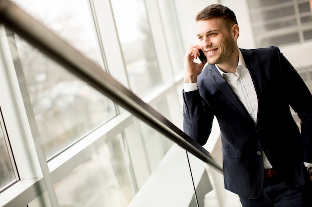 Handsome  businessman in classic suit  talking on mobile phone