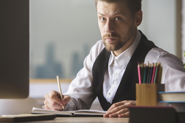 Handsome businessman doing paperwork