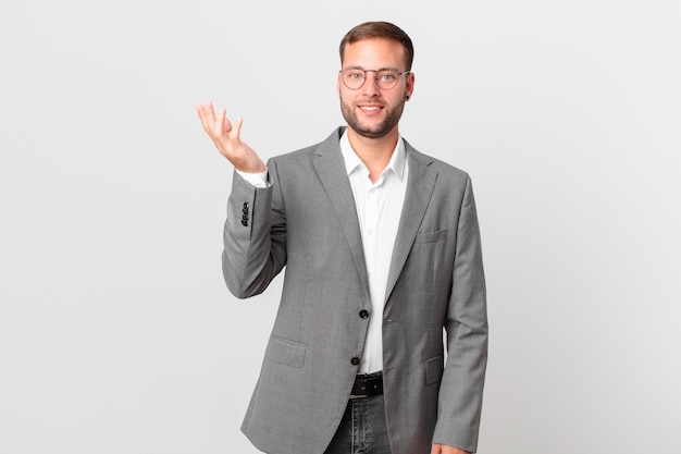 Handsome businessman feeling happy, surprised realizing a solution or idea