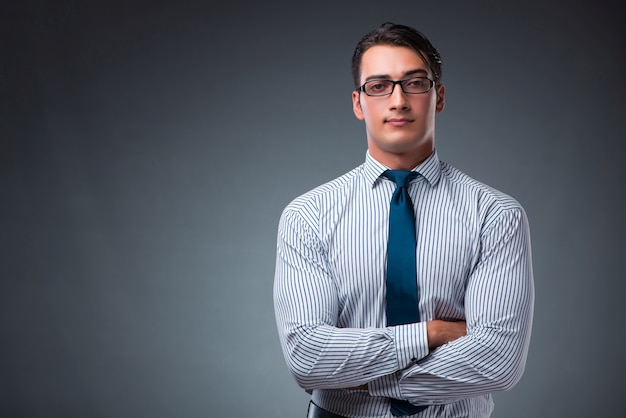 Handsome businessman on gray