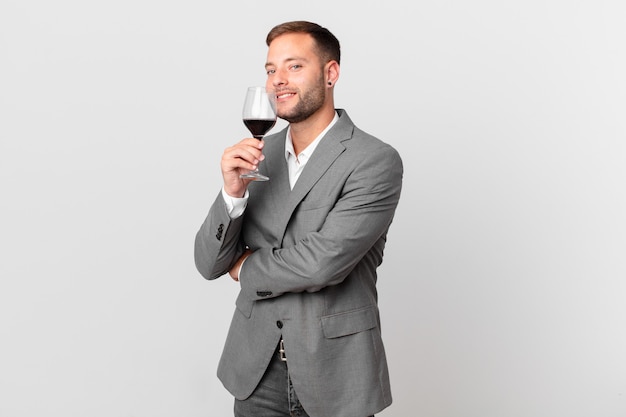 Handsome businessman having a wine