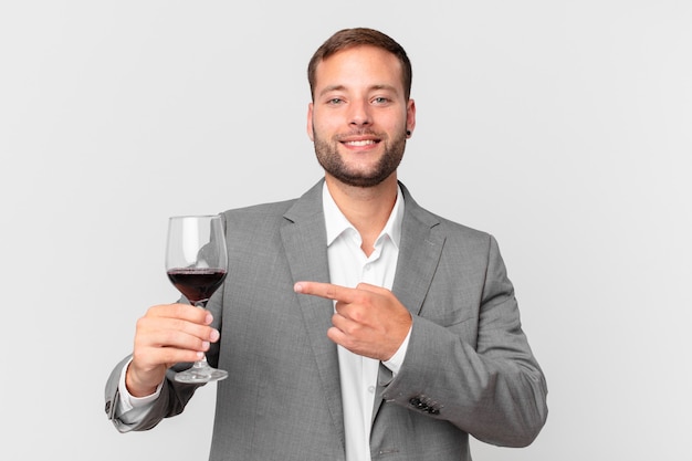 Handsome businessman having a wine