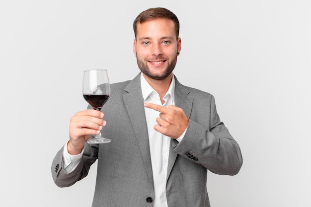 Handsome businessman having a wine