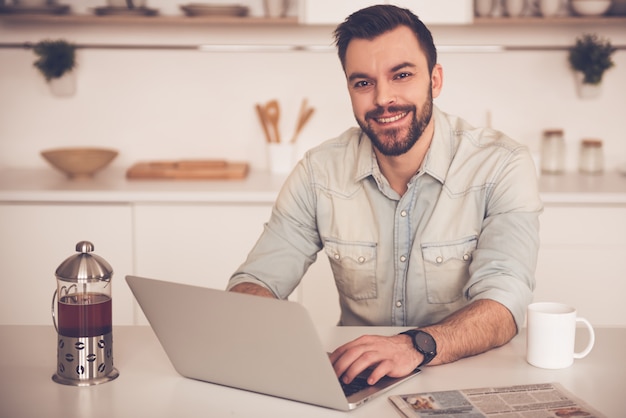 Handsome businessman is looking at camera