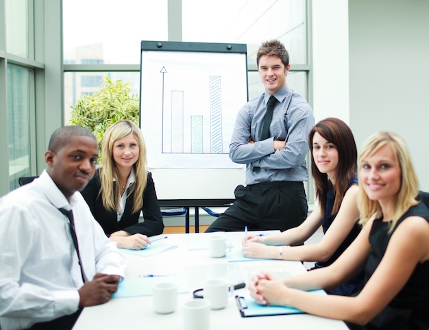 Handsome businessman in a meeting with his colleagues