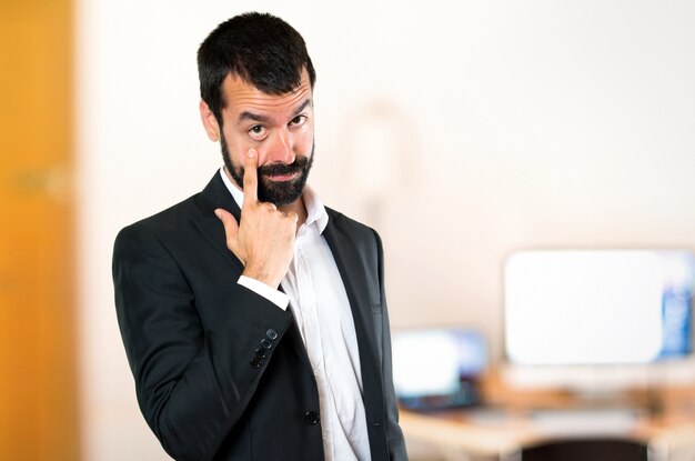 Handsome businessman showing something in the office