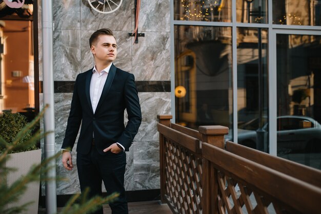 Handsome businessman on a terrace