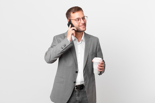 Handsome businessman using his smart phone