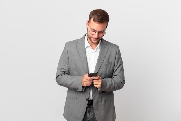 Handsome businessman using his smart phone