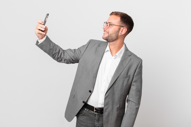 Handsome businessman using his smart phone