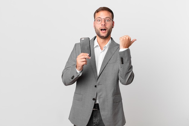 Handsome businessman using his smart phone