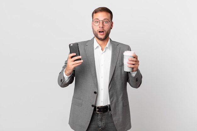 Handsome businessman using his smart phone