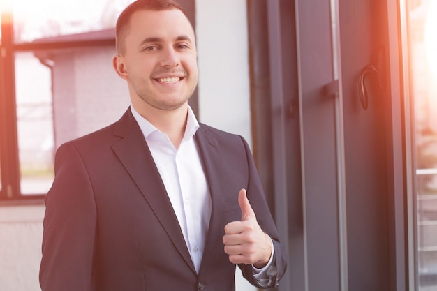 Handsome businessman wearing a black suit