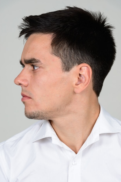 handsome businessman with beard stubble on white