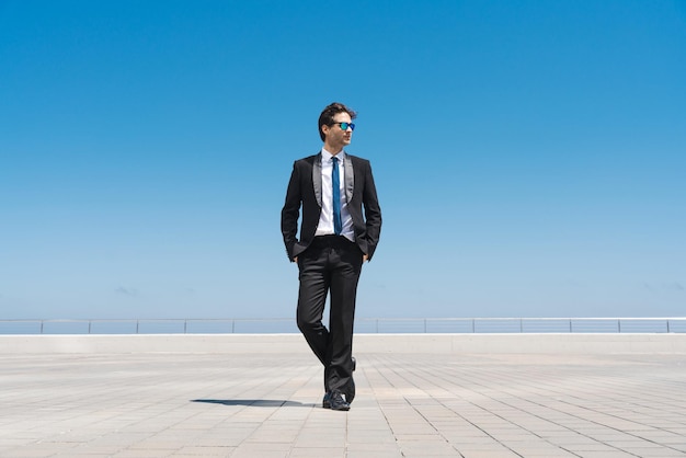 Handsome businessman with elegant suit outdoors portrait
