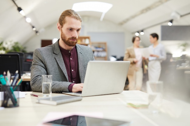 Handsome Businessman Working in Open Space Office