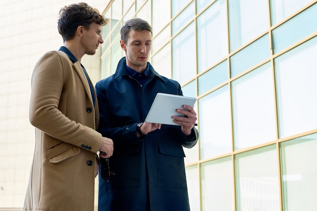 Handsome Businessmen Using Tablet Outdoors