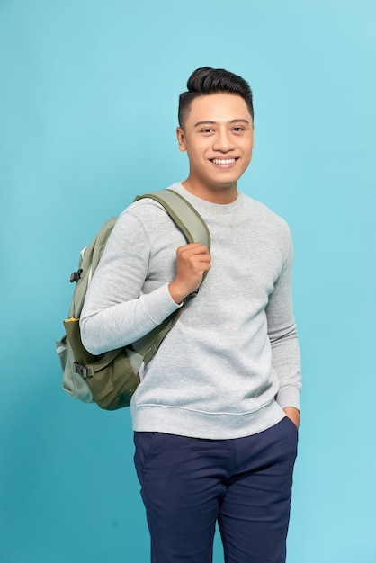 Handsome casual guy wearing backpack